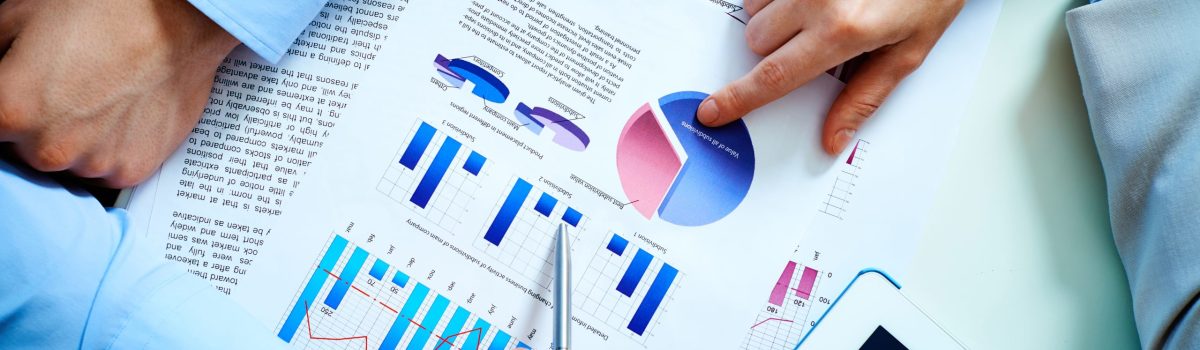 Close-up of female and male hands pointing at business document while discussing it